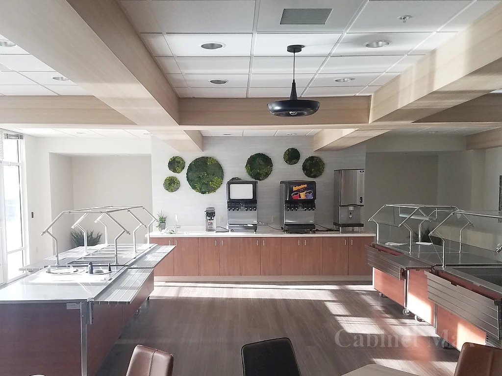Commercial dining space with wood cabinetry and light wood ceiling features