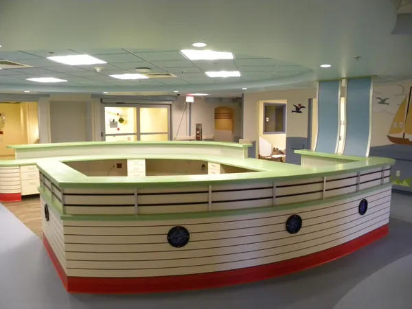 Boat-shaped reception desk at AAMC.
