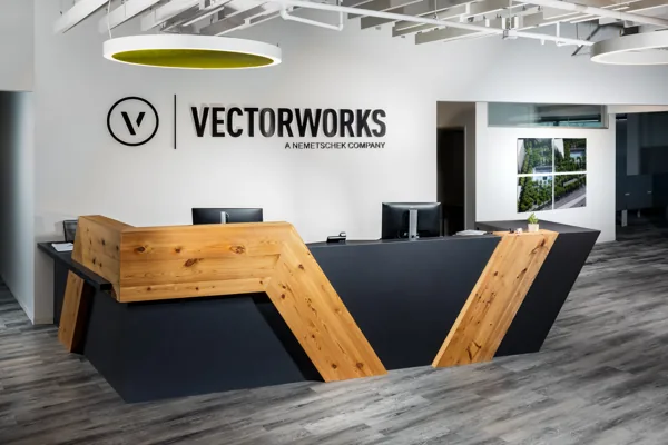 Stone-faced reception desk and wood details at Vectorworks Headquarters.