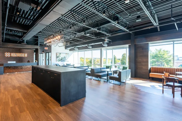 Café island, lounge and reception at Venture X Frederick.
